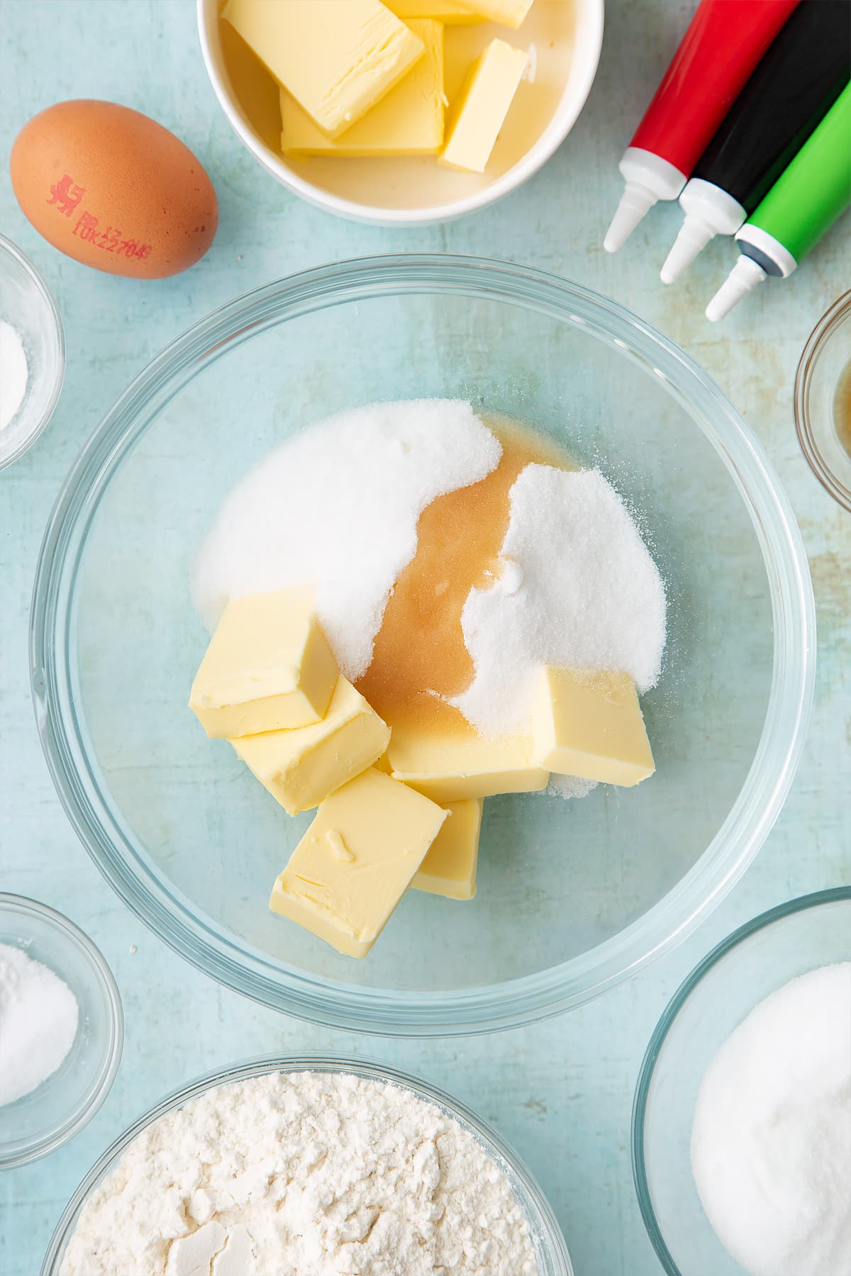 Overhead shot of butter, sugar and vanilla in a bowl