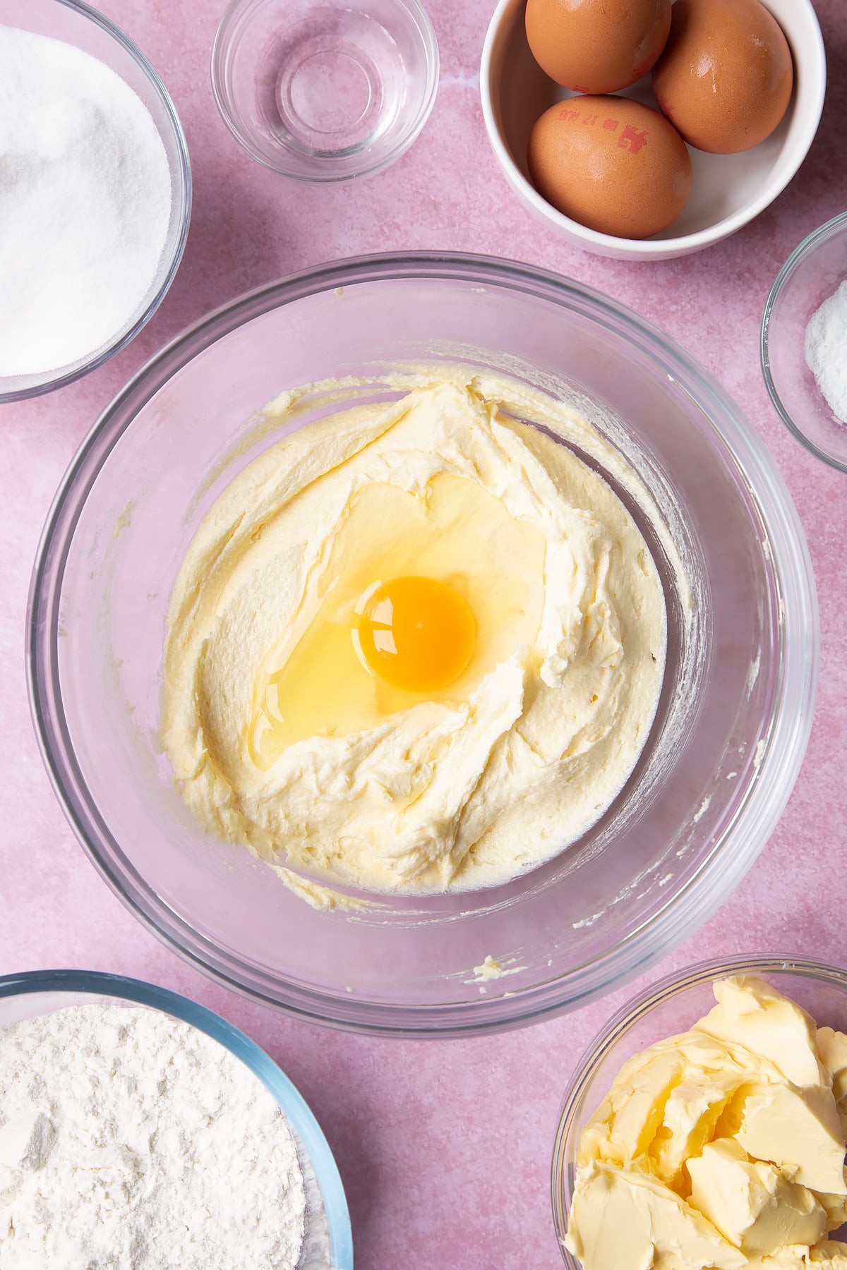 Overhead shot of fluffed margarine and sugar in a mixing bowl