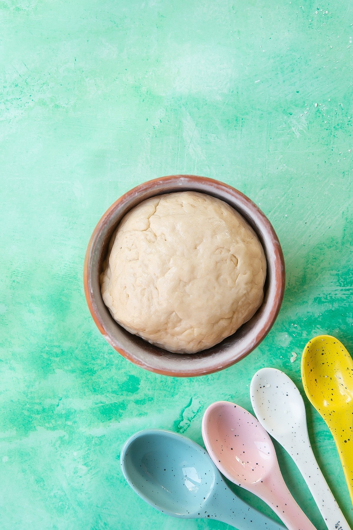 Overhead shot of the dough inside the flower pot.