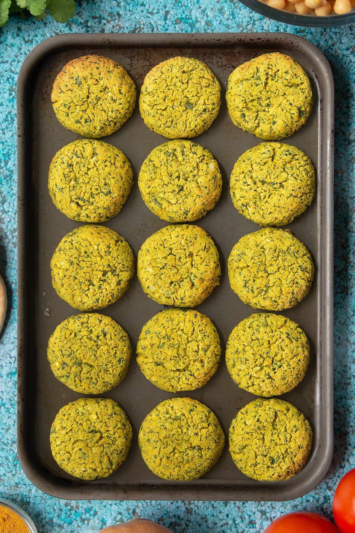 Cooked gluten-free falafel on a baking tray.