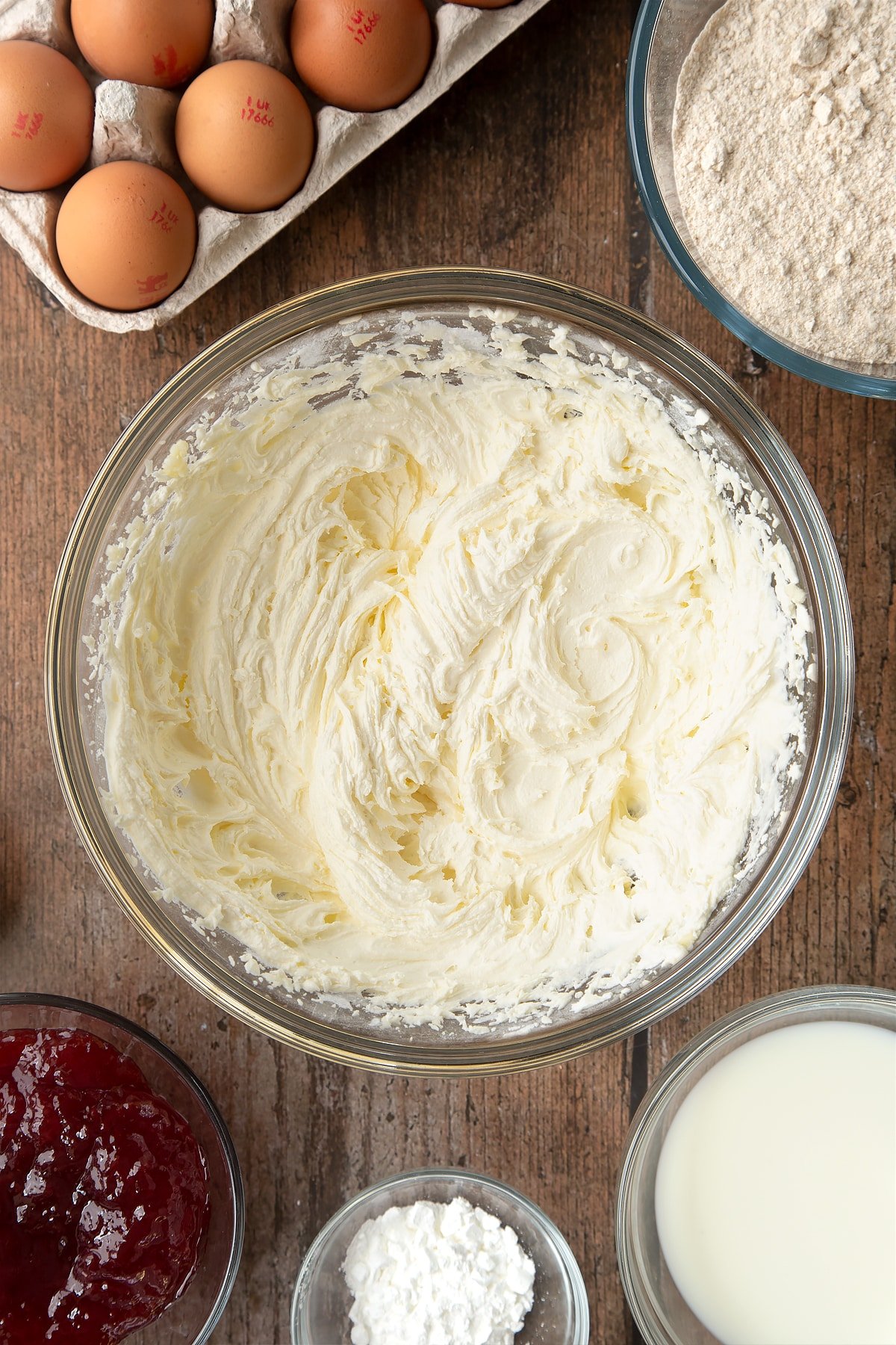 Overhead shot of buttermix in a large clear mixing bowl