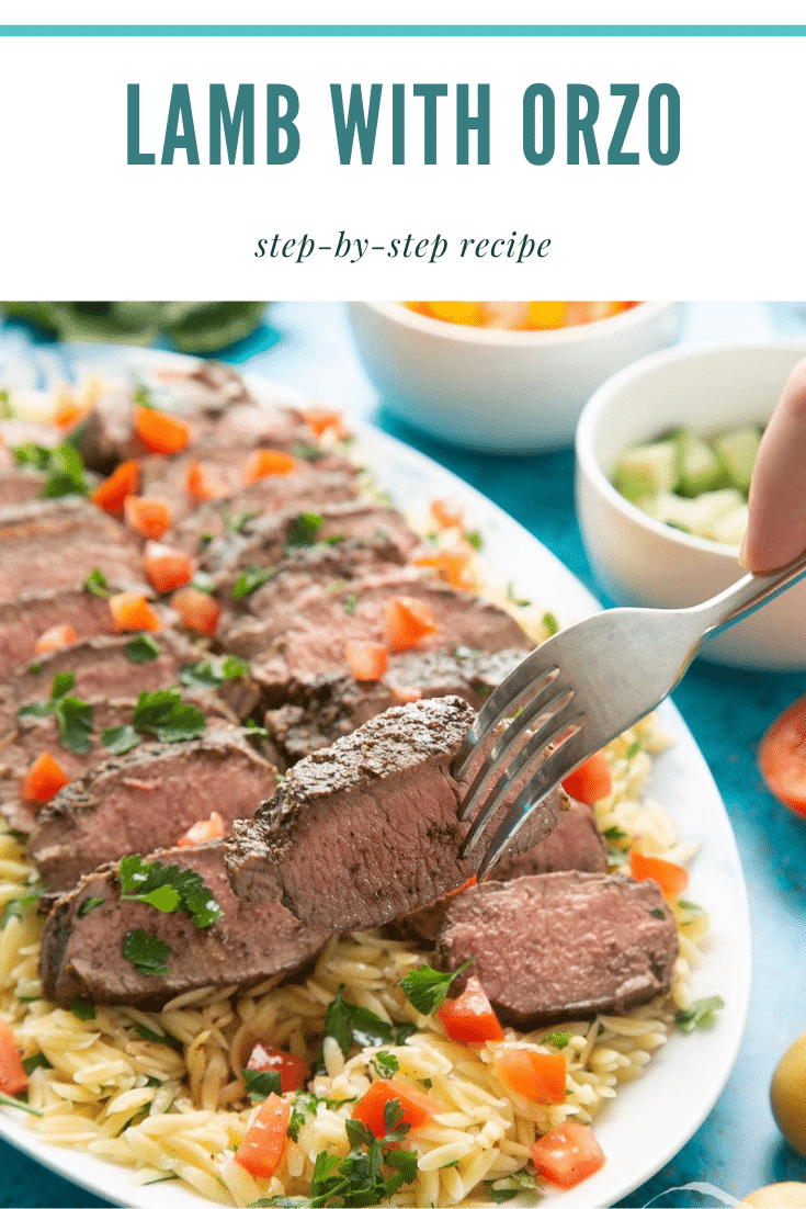 Slices of herby lamb arranged on a bed of orzo on an oval platter. A fork lifts some lamb. Caption reads: lamb with orzo step-by-step recipe