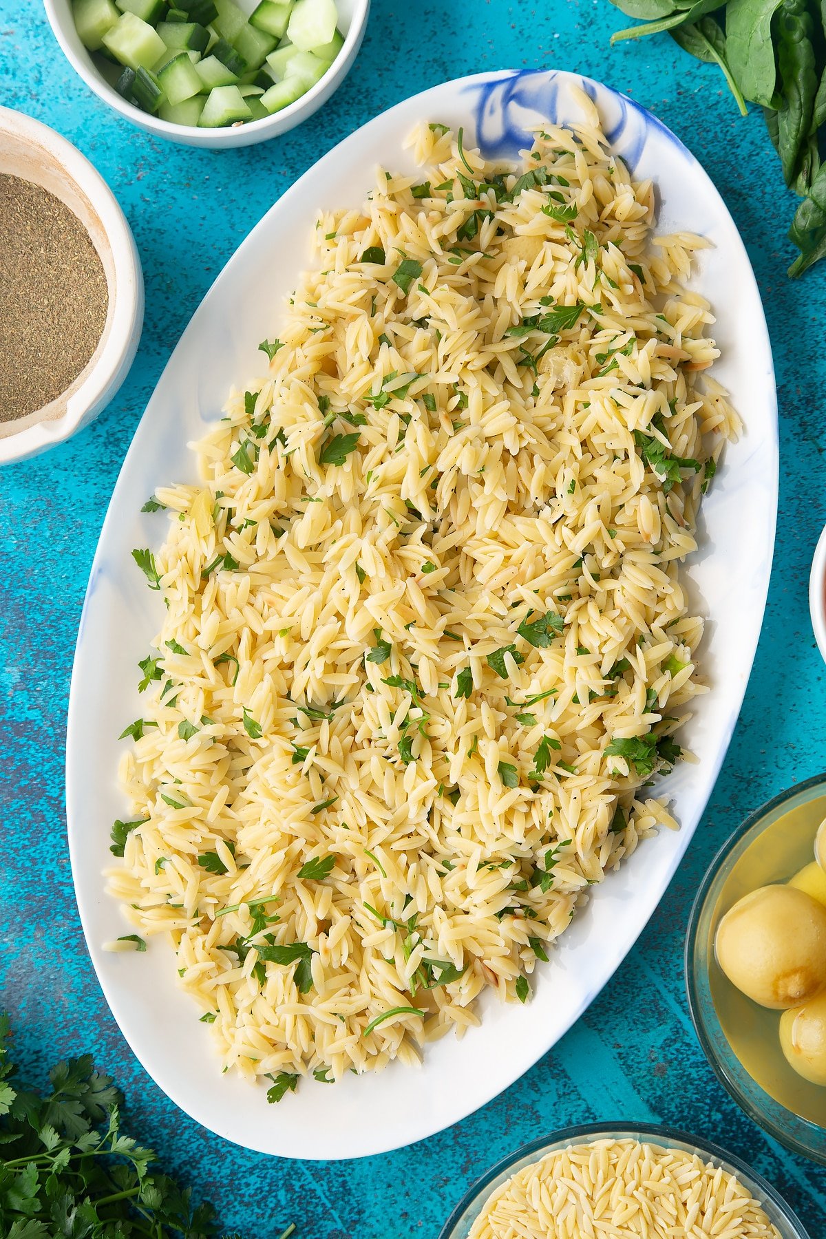 Lemony orzo spread on an oval platter. 