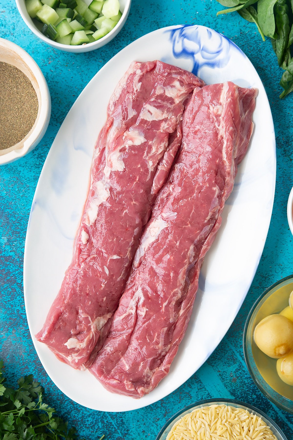 Two pieces of cannon of Welsh lamb on an oval platter. 