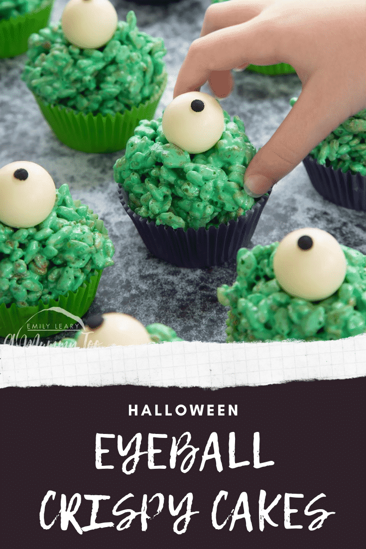 Halloween crispy cakes, dyed green and topped with white chocolate spheres decorated to look like eyeballs. A little hand reaches for one. Caption reads: Halloween eyeball crispy cakes