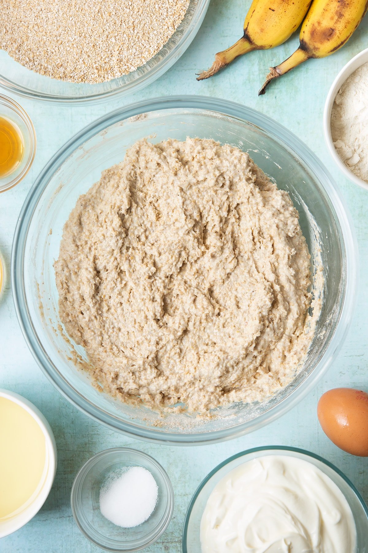 Overhead shot of muffin mix in a clear bowl