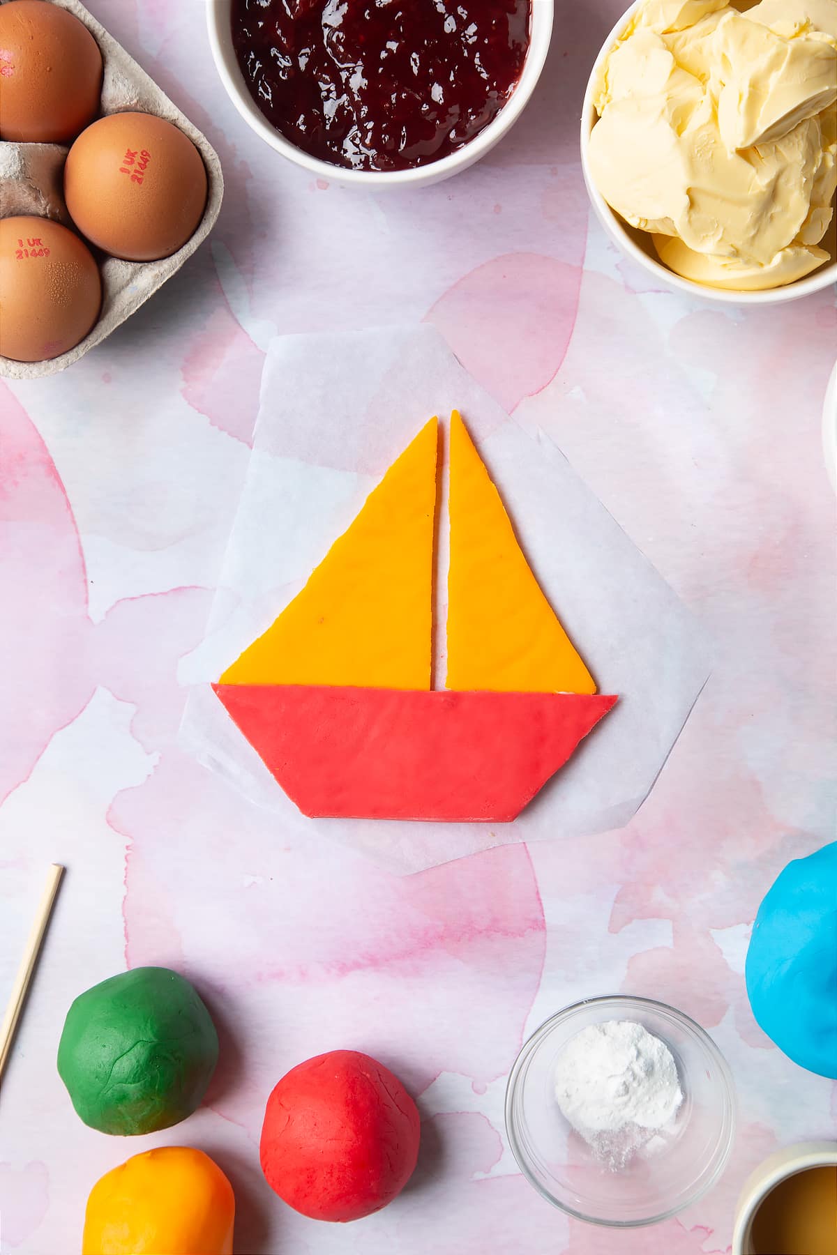 Overhead shot of a boat made from pieces of sugar paste.