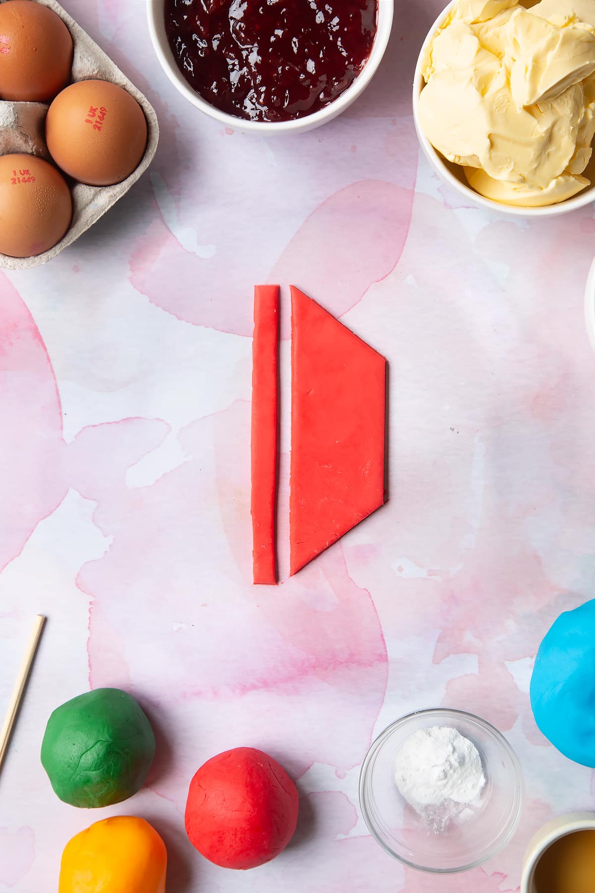 Overhead shot of thin strips of red sugar paste