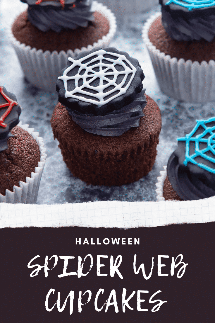 Spider web cupcakes arranged on a black surface. The chocolate sponge cupcakes are topped with purple vanilla buttercream and discs of black sugar paste decorated with spider web icing. Caption reads: Halloween spider web cupcakes