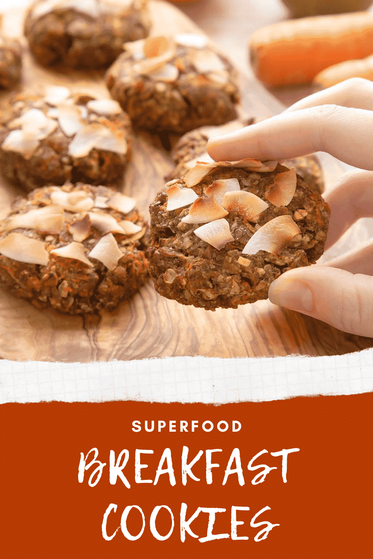 Hand holding superfood breakfast cookies. At the bottom of the image there's some text describing the image for Pinterest.
