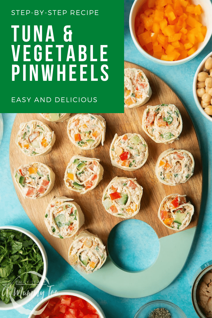 Tuna pinwheels on a board with fresh fruit and veg around it. Caption reads: step-by-step recipe tuna & vegetable pinwheels easy & delicious