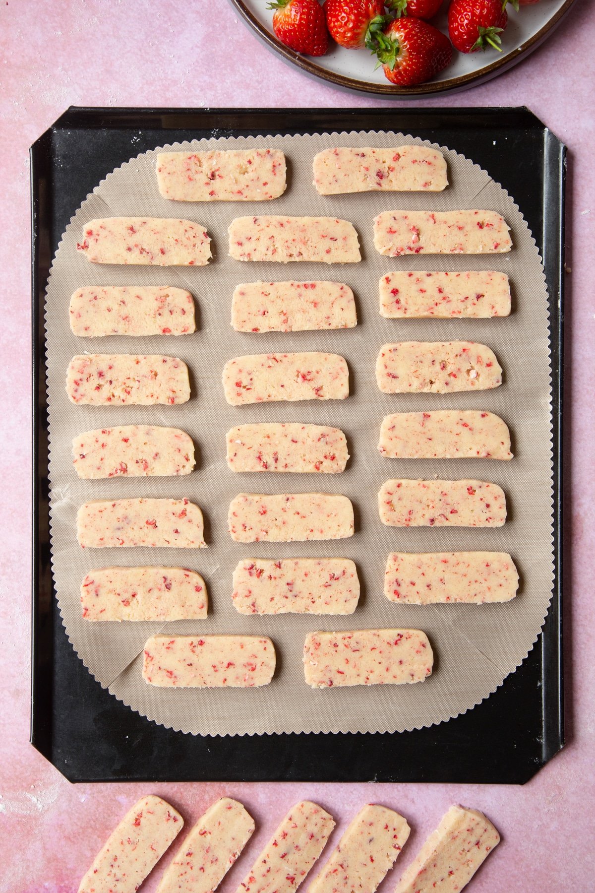 The strawberry biscuit dough is placed onto a baking sheet.