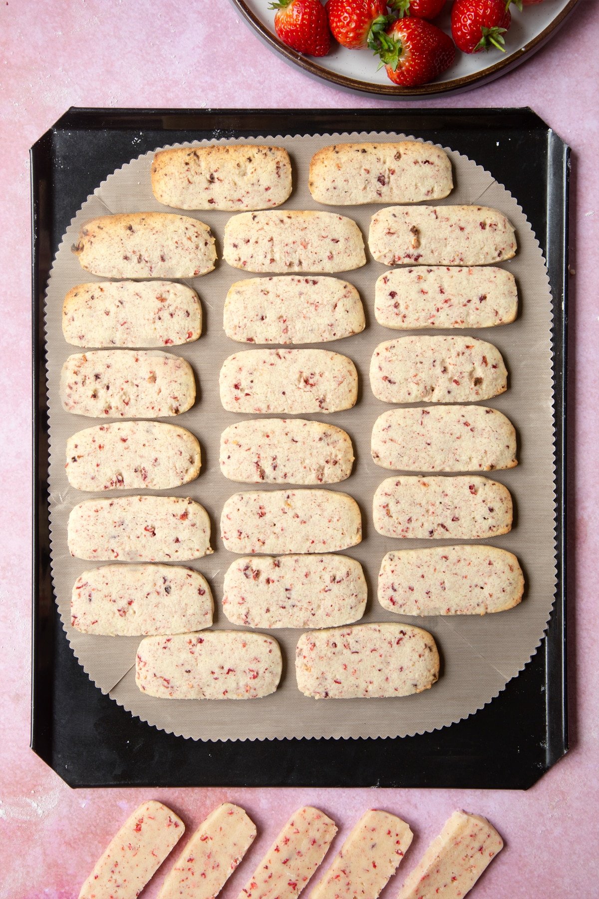 The strawberry biscuits having been baked in the oven for five minutes.