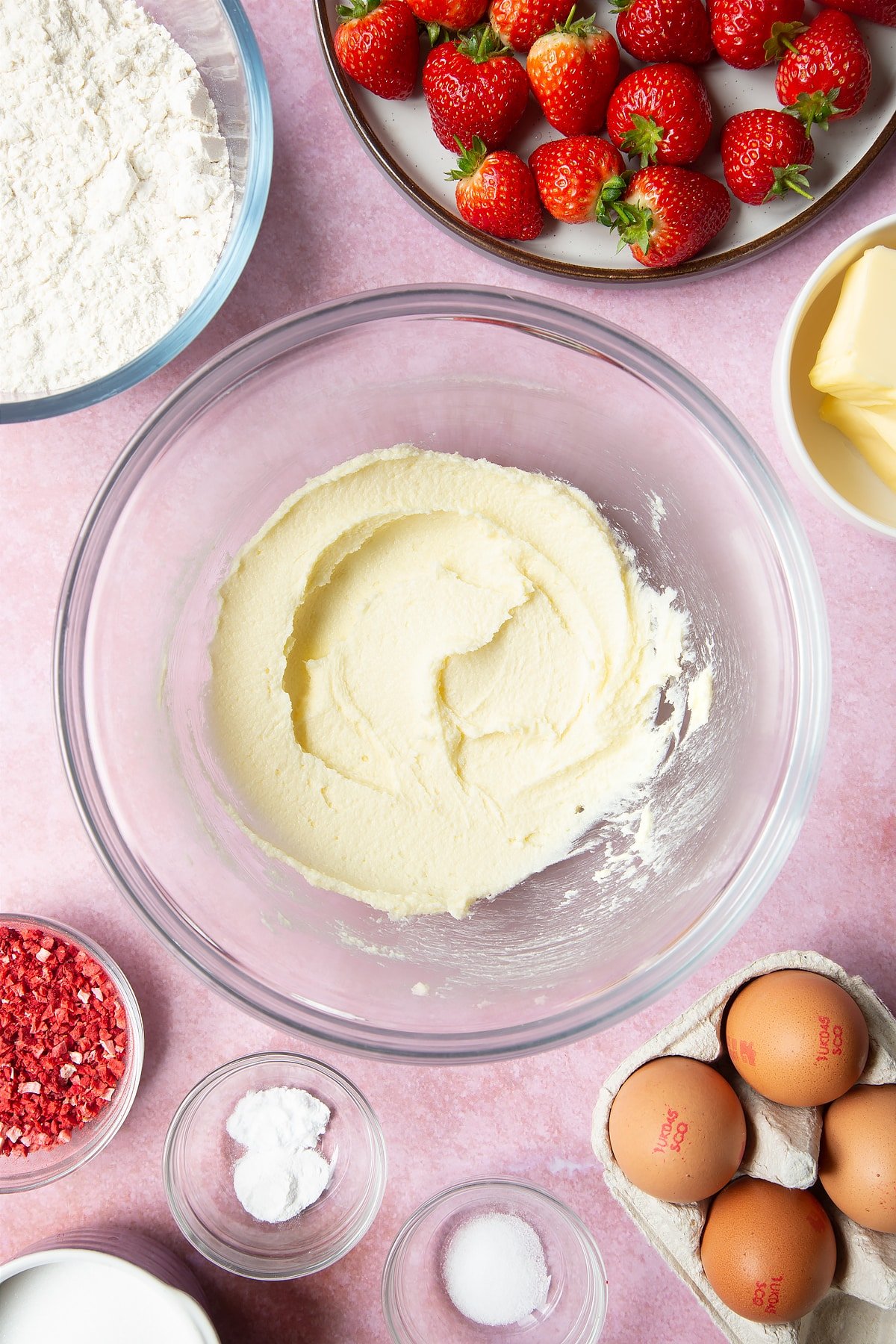 The butter and sugar has been beaten in a bowl until it's become light and fluffy.