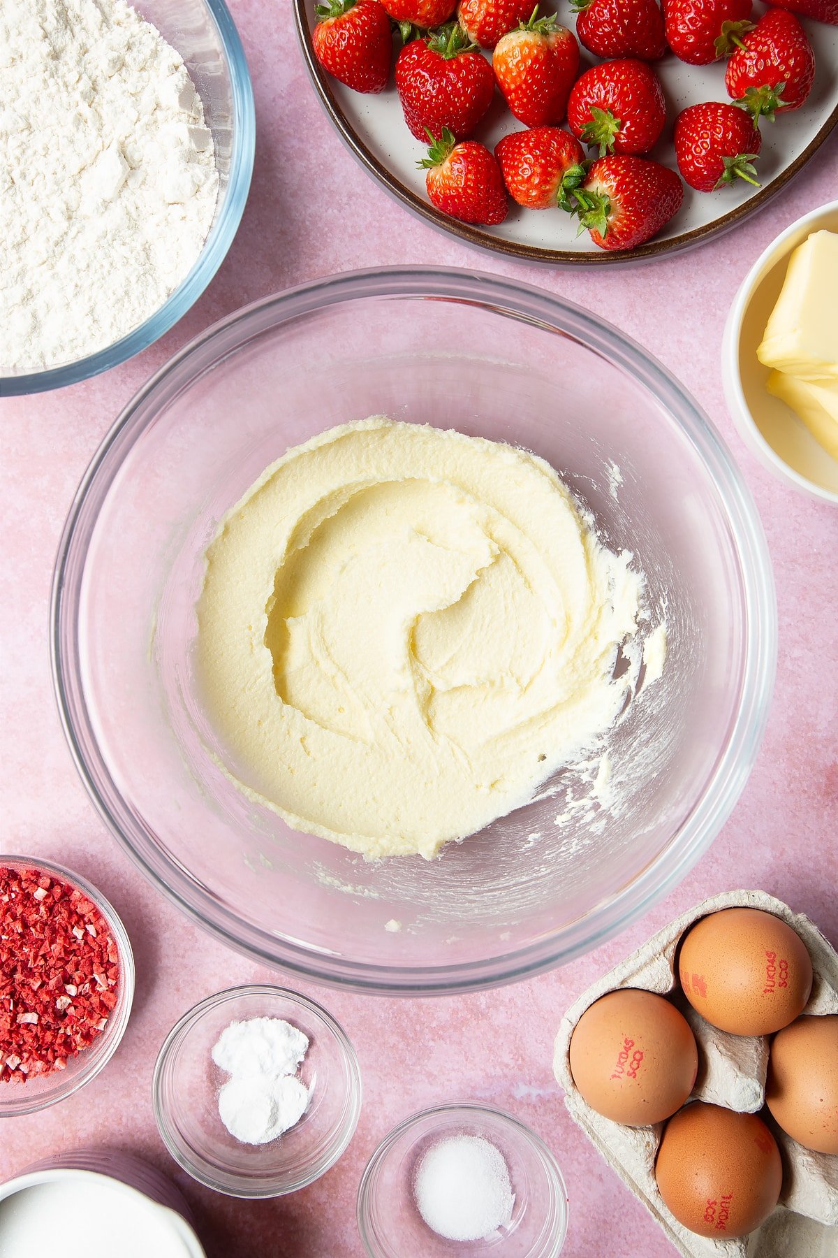 The butter and sugar has been beaten in a bowl until it's become light and fluffy.