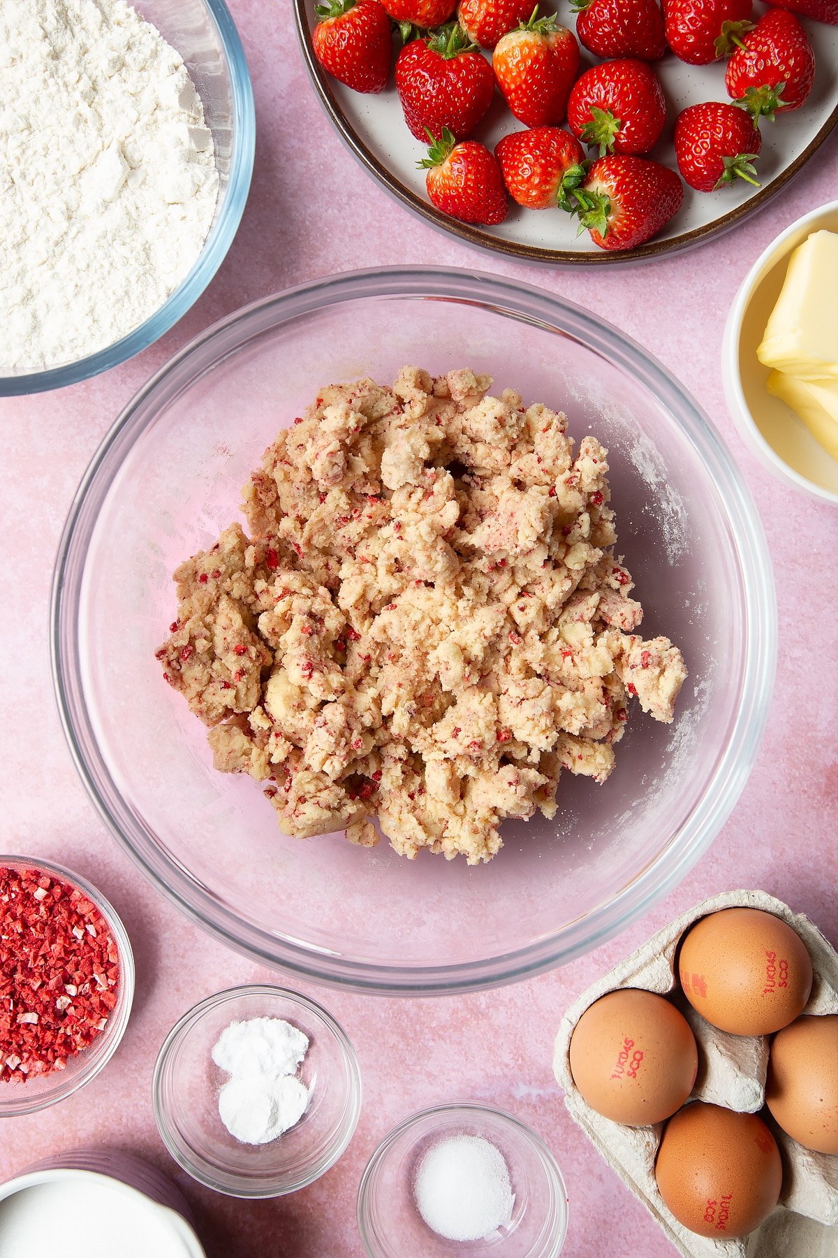 The strawberry pieces mixed into the strawberry biscuit mixture.