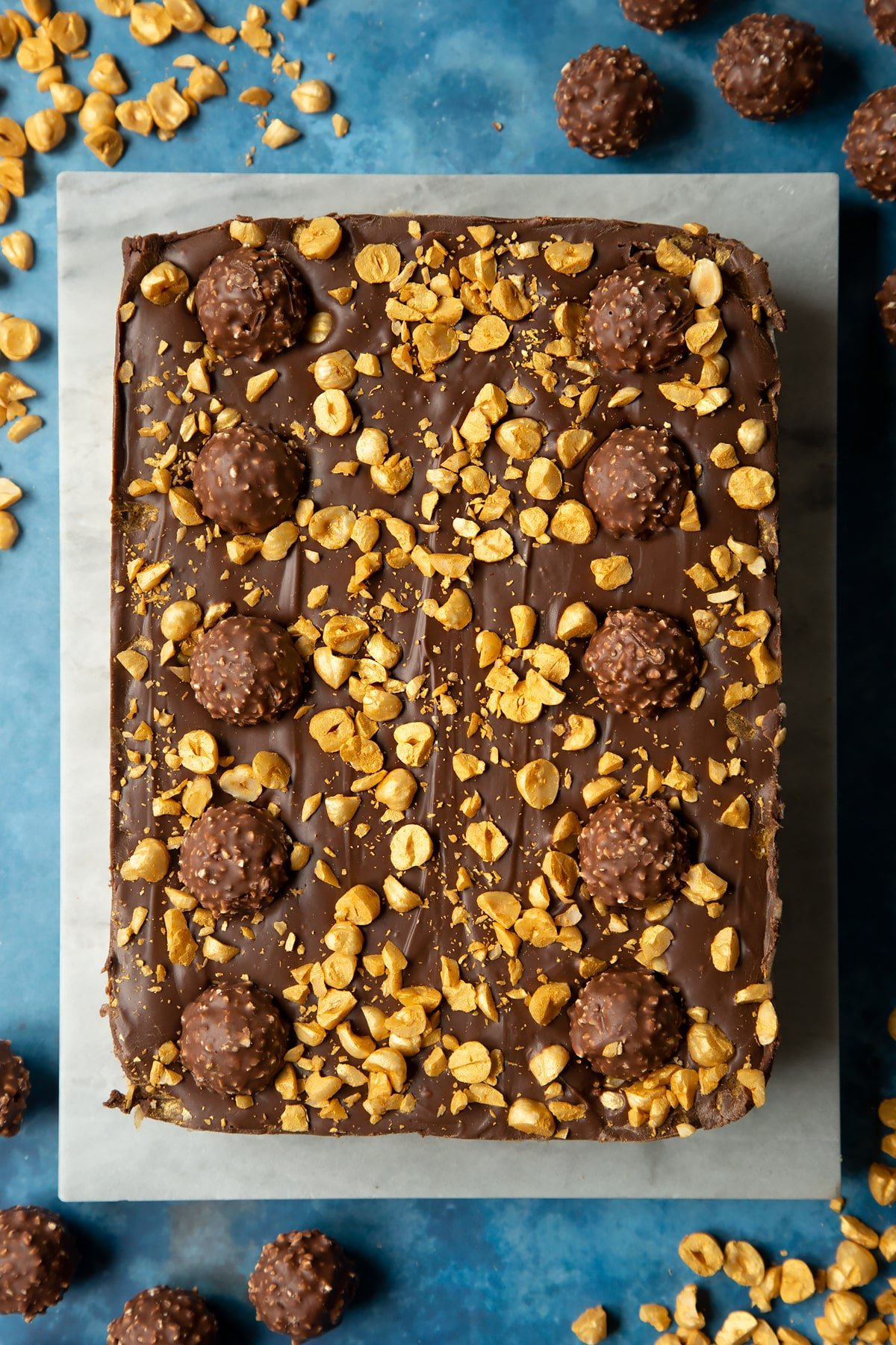 Marble board with large  Ferrero Rocher slice. 