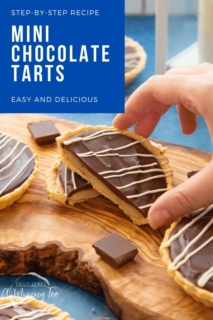 Mini chocolate tarts on an olive board. One tart has been cut in half. A hand holds a half. Caption reads: step-by-step recipe mini chocolate tarts easy and delicious