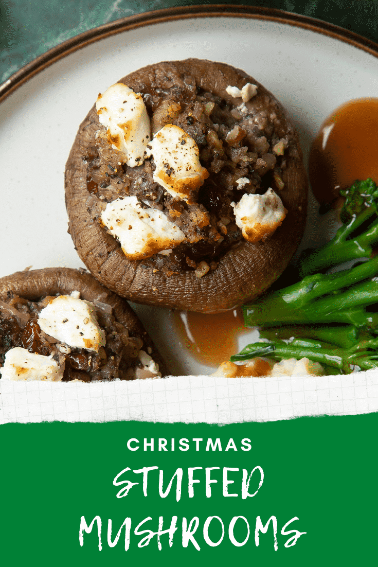 Overhead shot of stuffed mushrooms topped with cripy goat cheese served on a gray plate