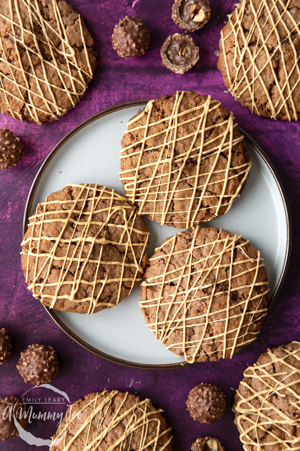 Three Ferrero Rocher cookies on a plate.