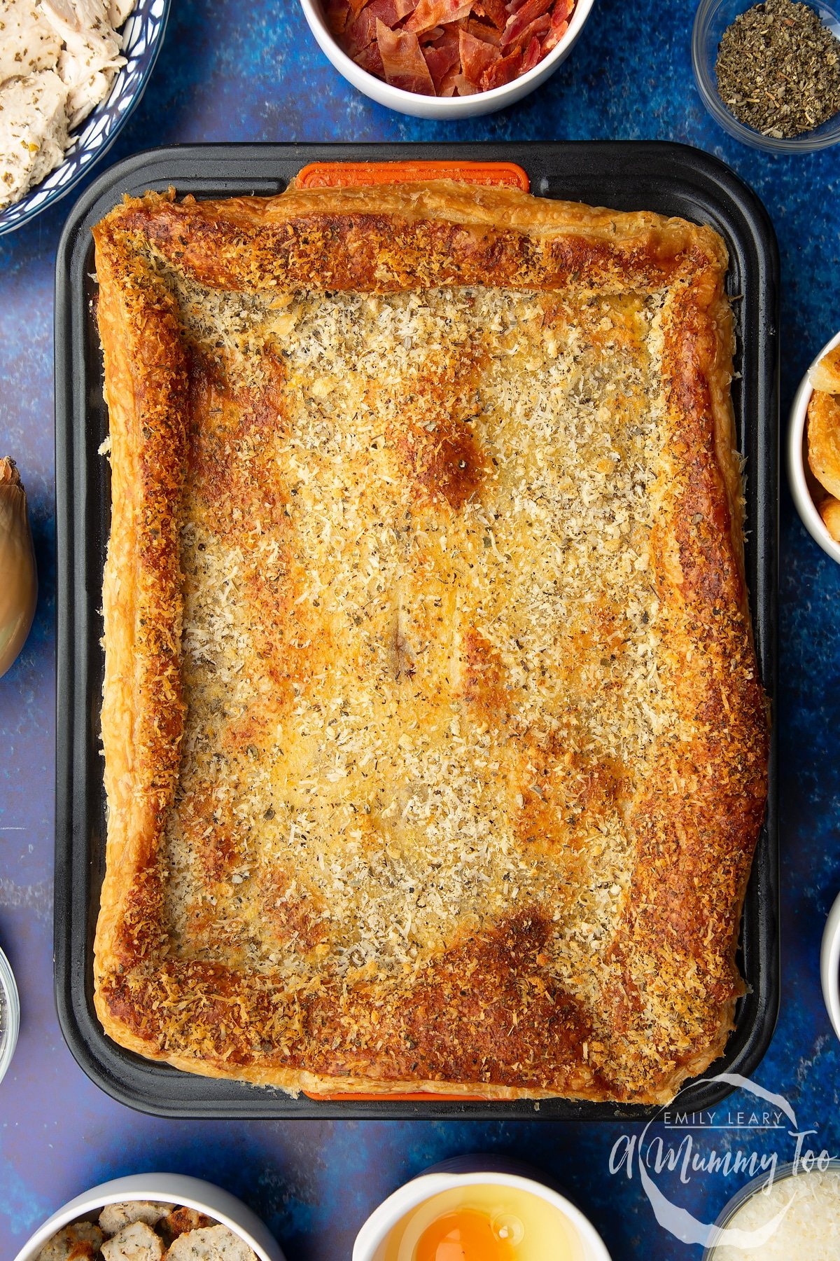 A cooked leftover Christmas dinner pie with a golden puff pastry top.