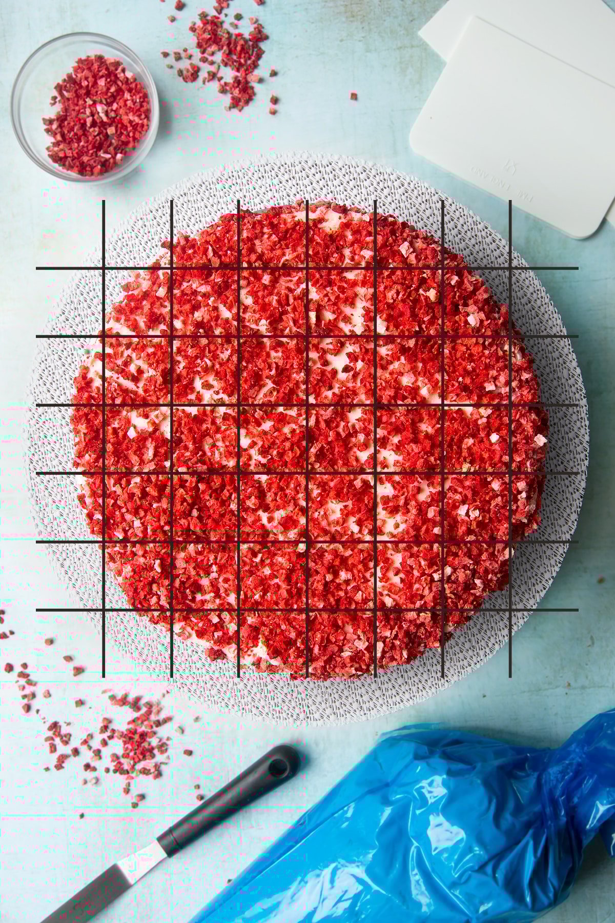 A pink ombre cake shown from above. Grid lines have been super imposed on top to show how the cake could be cut.