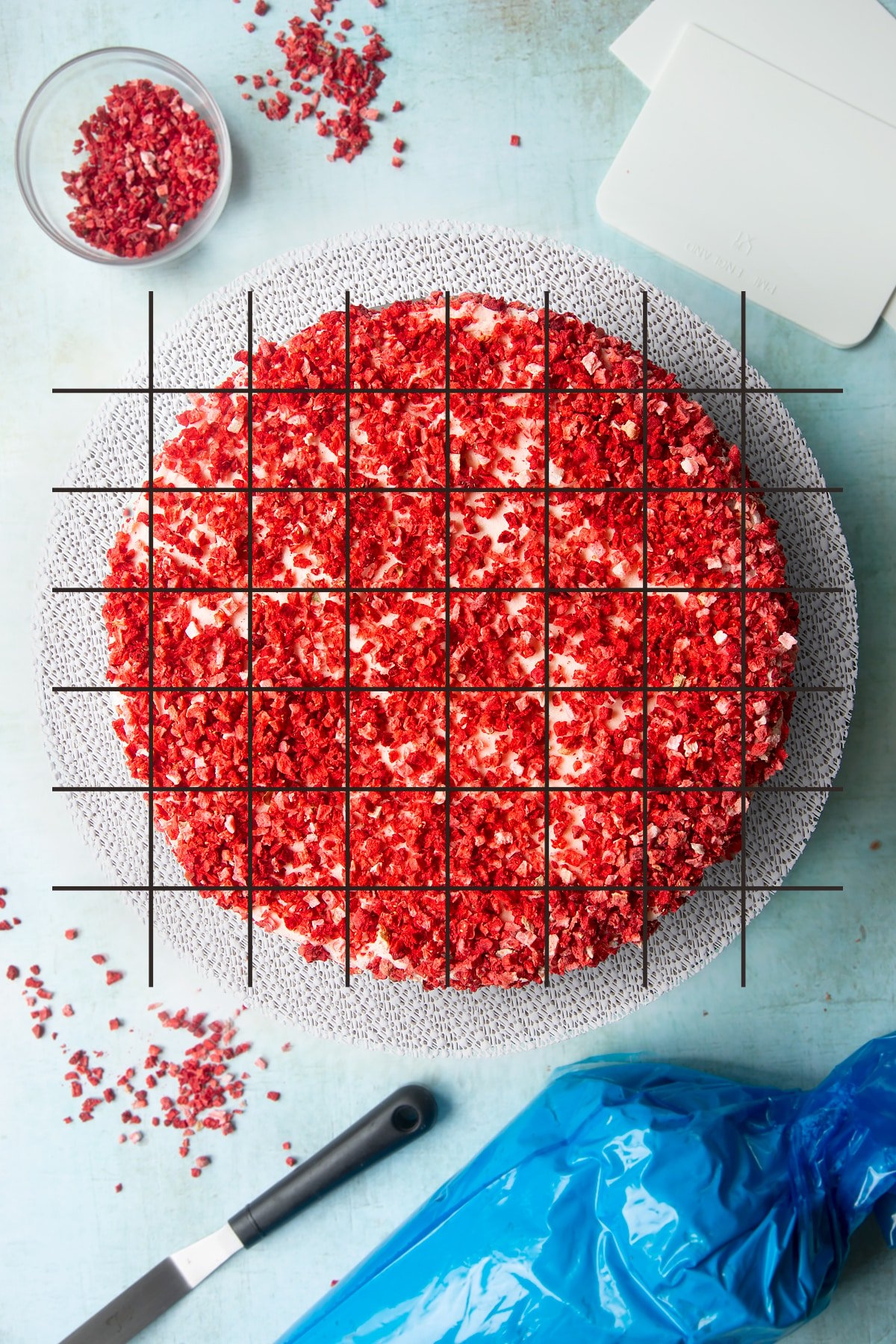 A pink ombre cake shown from above. Grid lines have been super imposed on top to show how the cake could be cut.