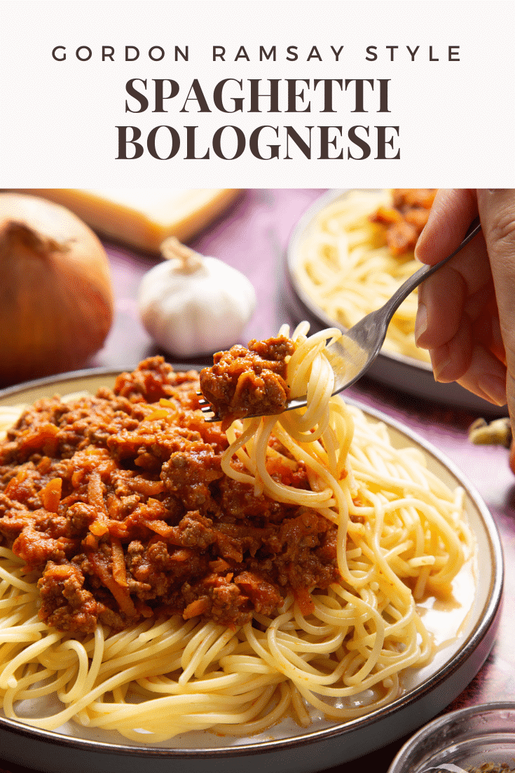 Side view spaghetti bolognese Gordon Ramsay style served on plates. A fork lifts pasta from the plate. Caption reads: Gordon Ramsay style spaghetti bolognese