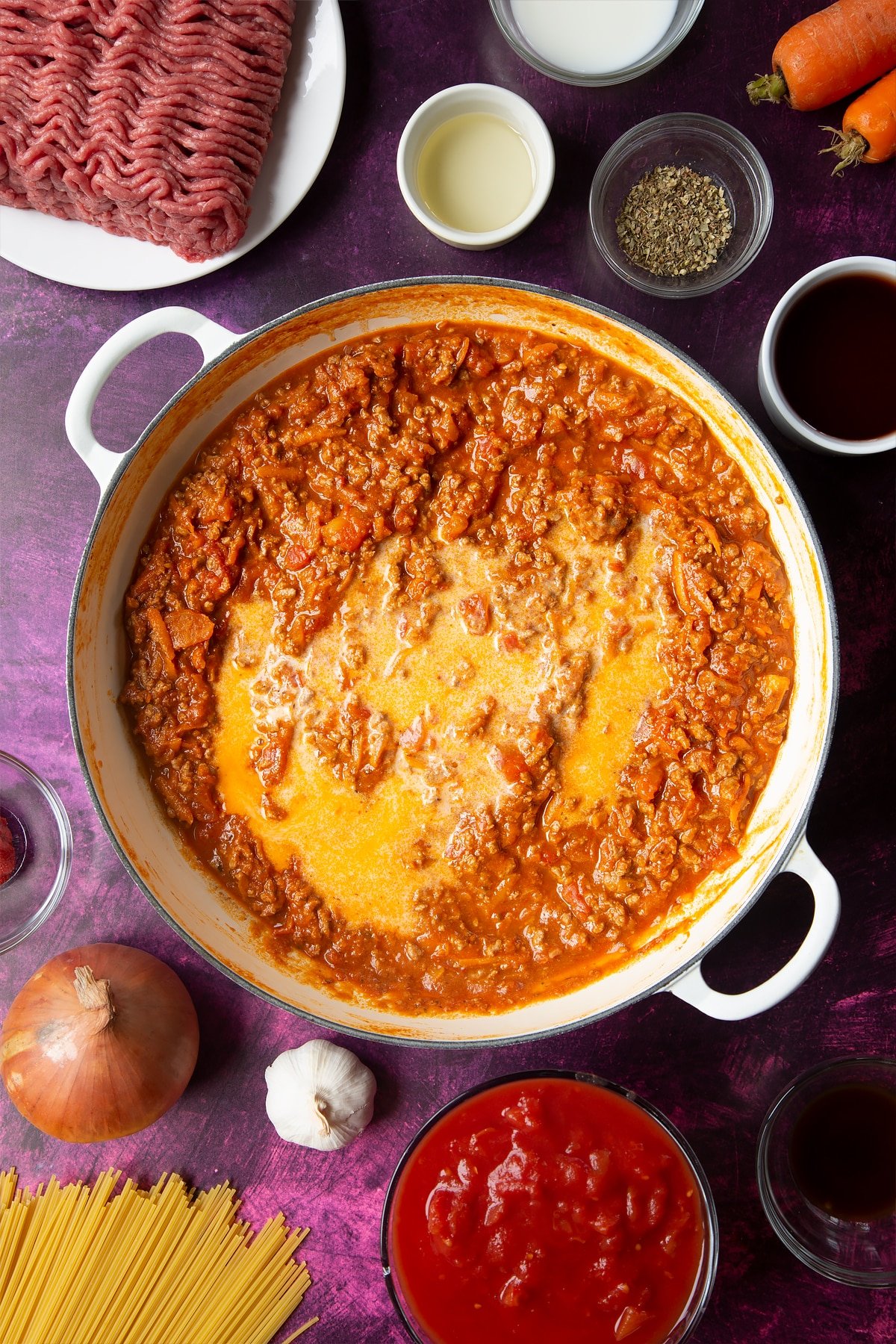 Reduced down spaghetti bolognese Gordon Ramsay style in a pan with milk added.