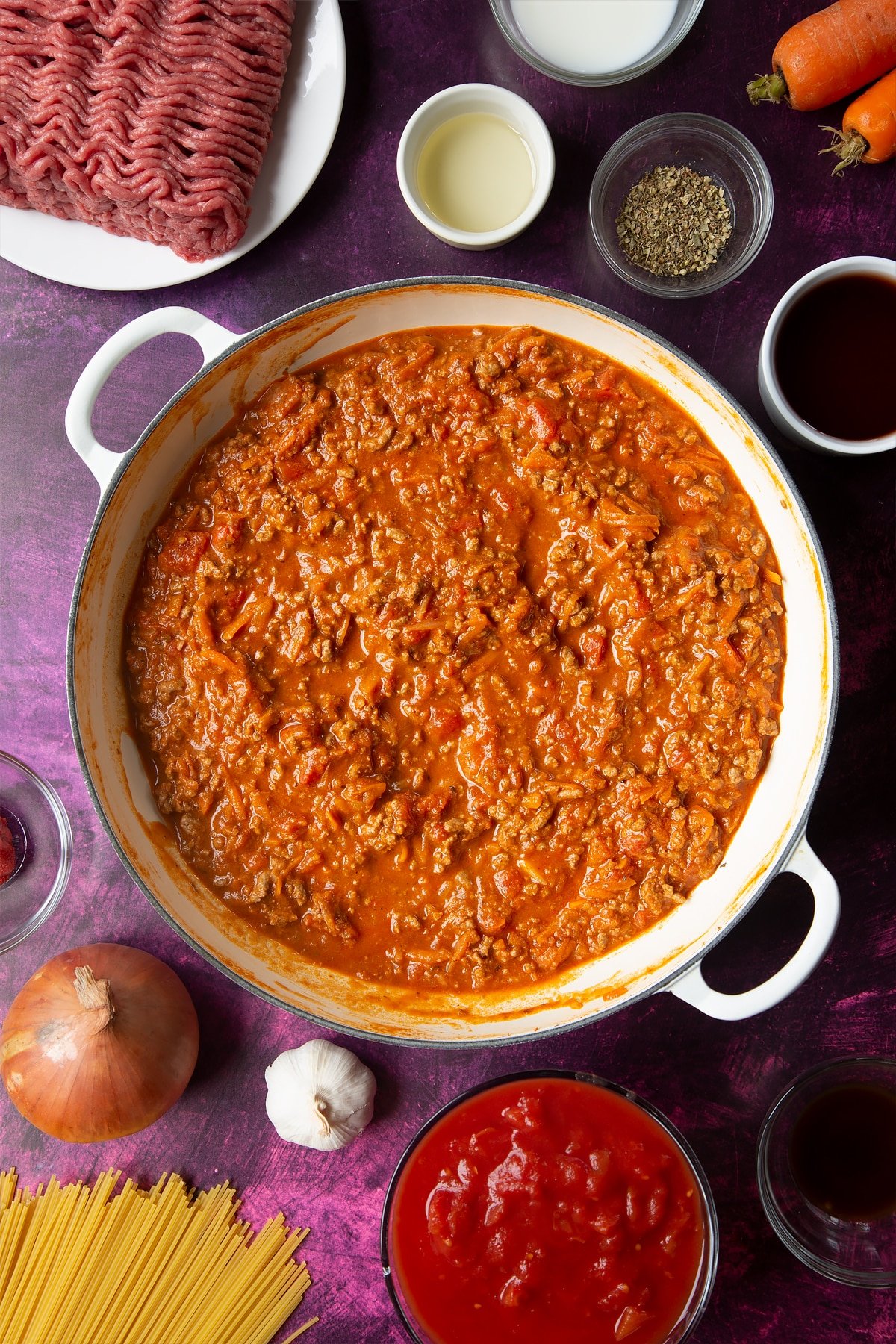 A large frying pan with spaghetti bolognese Gordon Ramsay style.