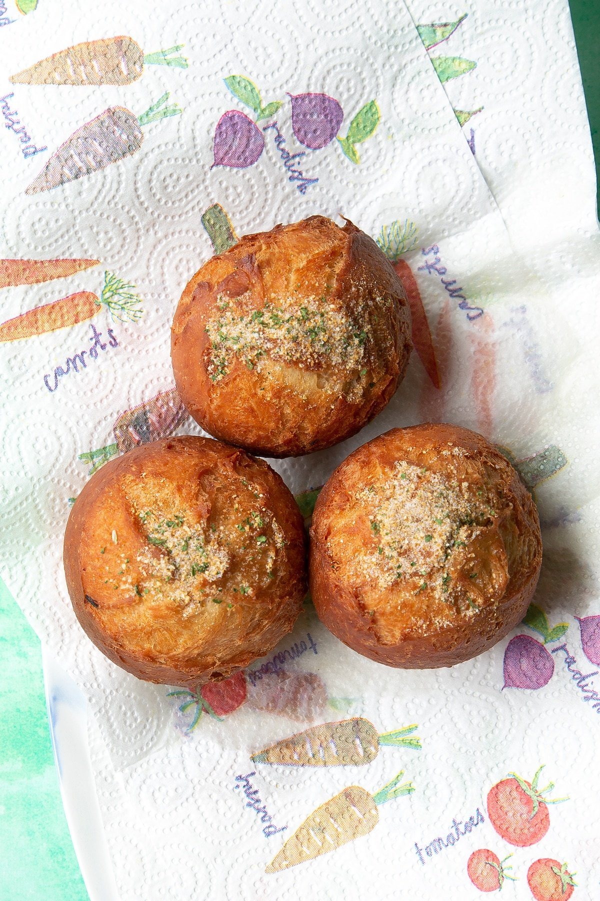 Freshly fried chicken doughnuts dusted with savoury spice mix.