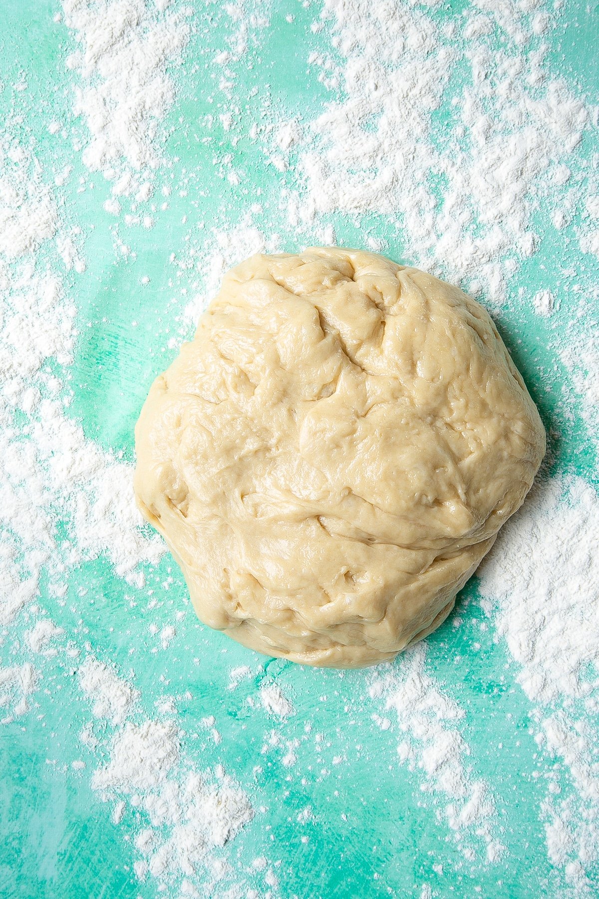 Bread dough on a floured surface.