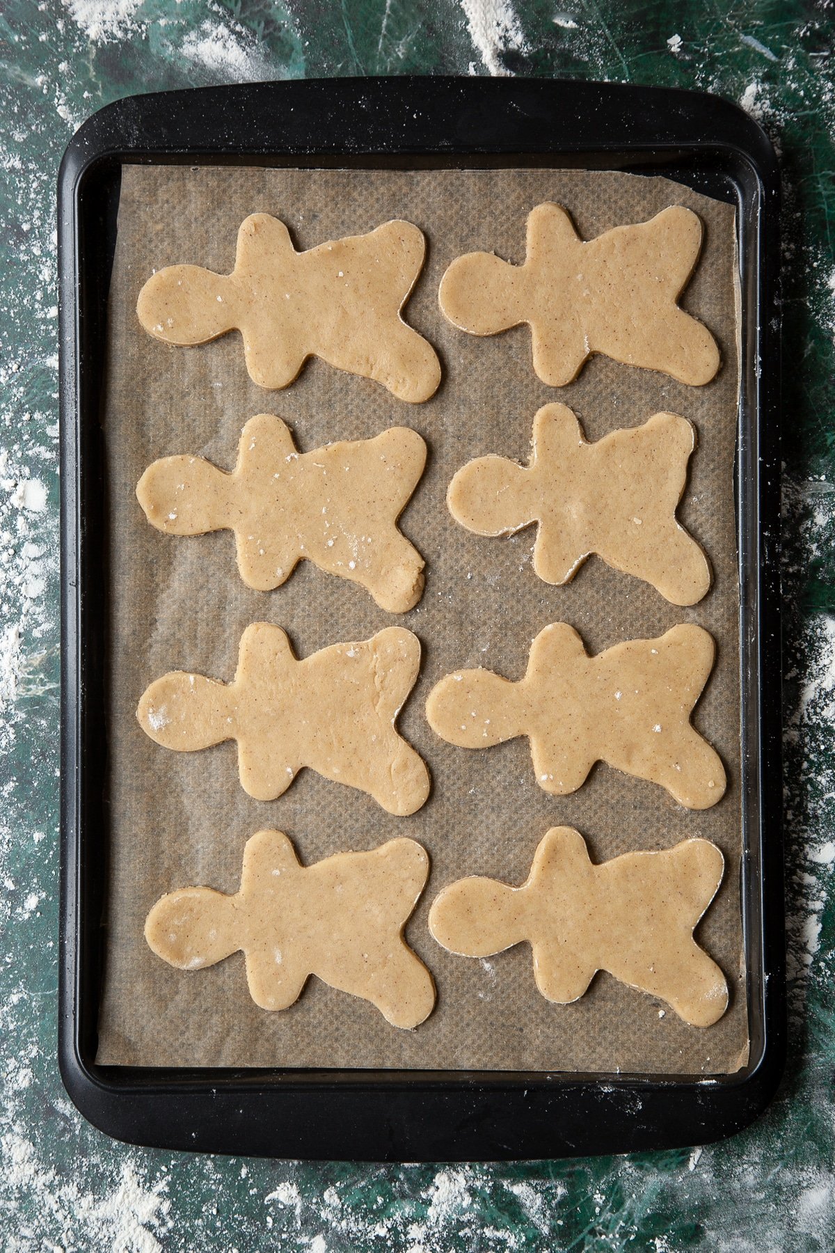 Cookies ready to bake on a tray lined with baking paper.