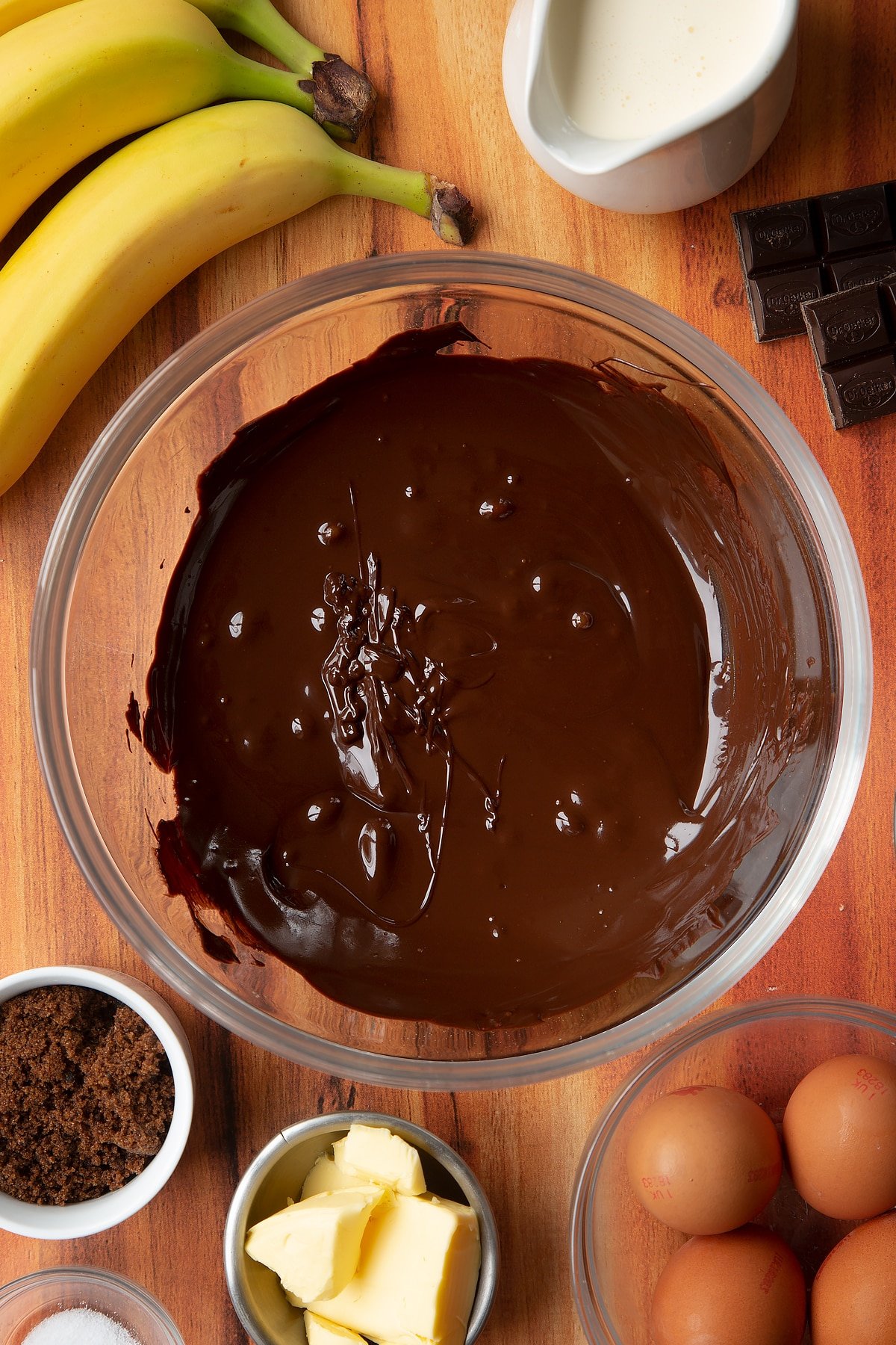 Melted chocolate in a clear mixing bowl.