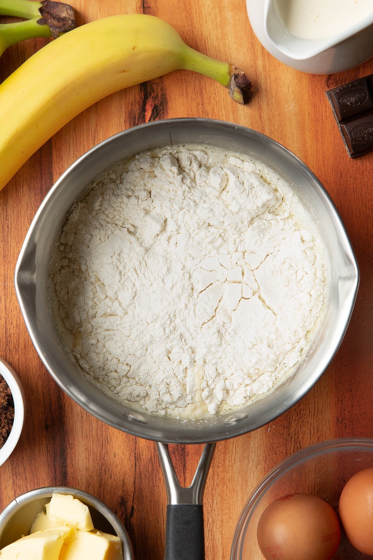 Overhead shot of butter liquid with flour in a pan