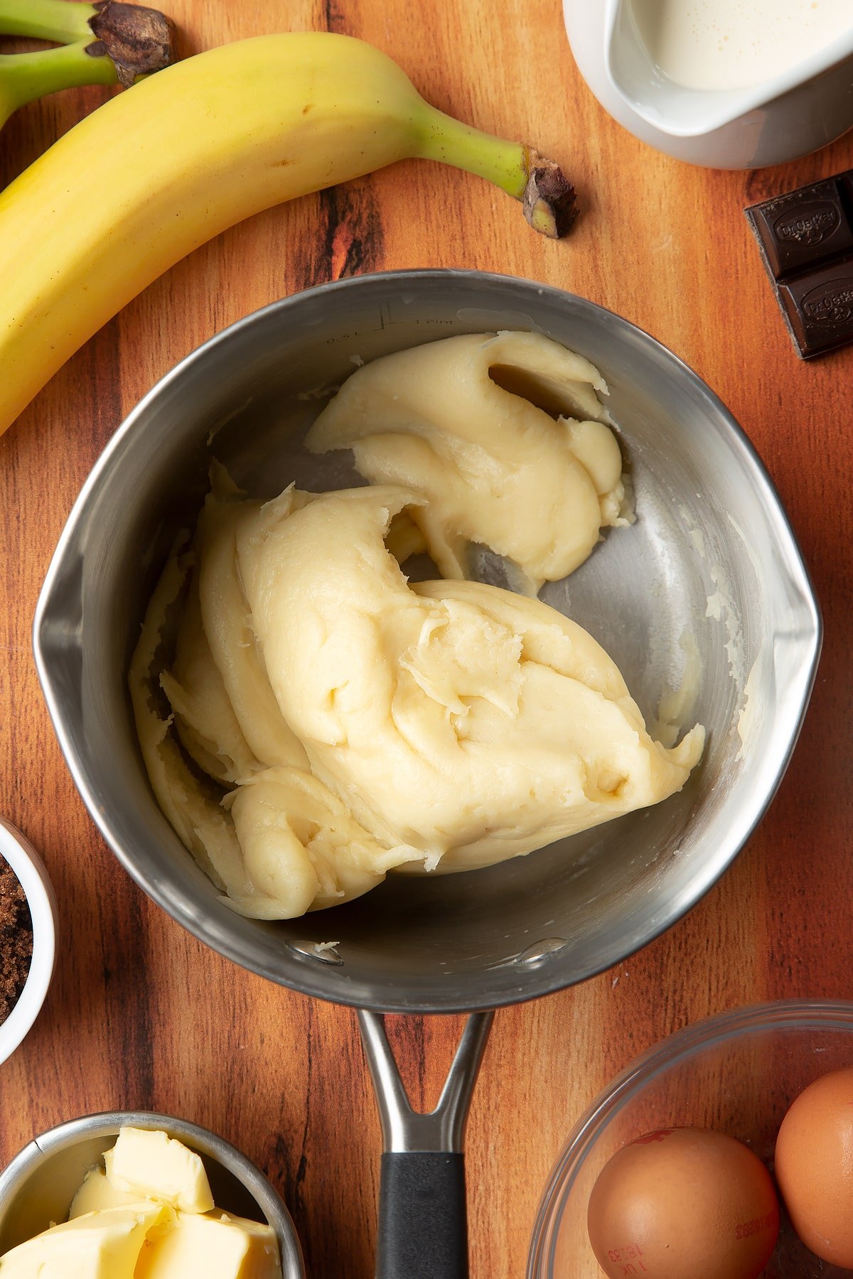 Overhead shot of choux pastry dough in a pan