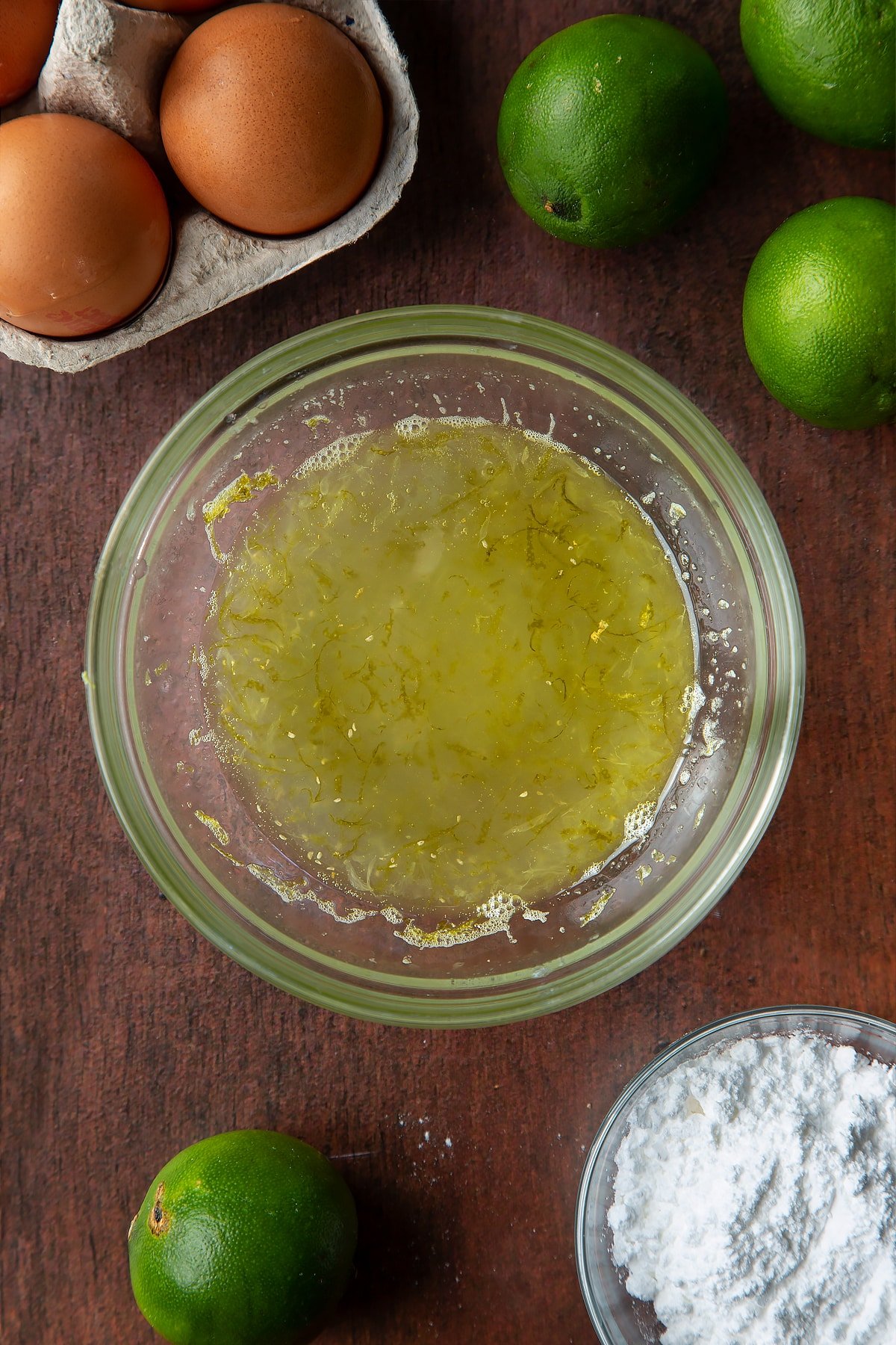 Lime drizzle syrup in a small bowl.