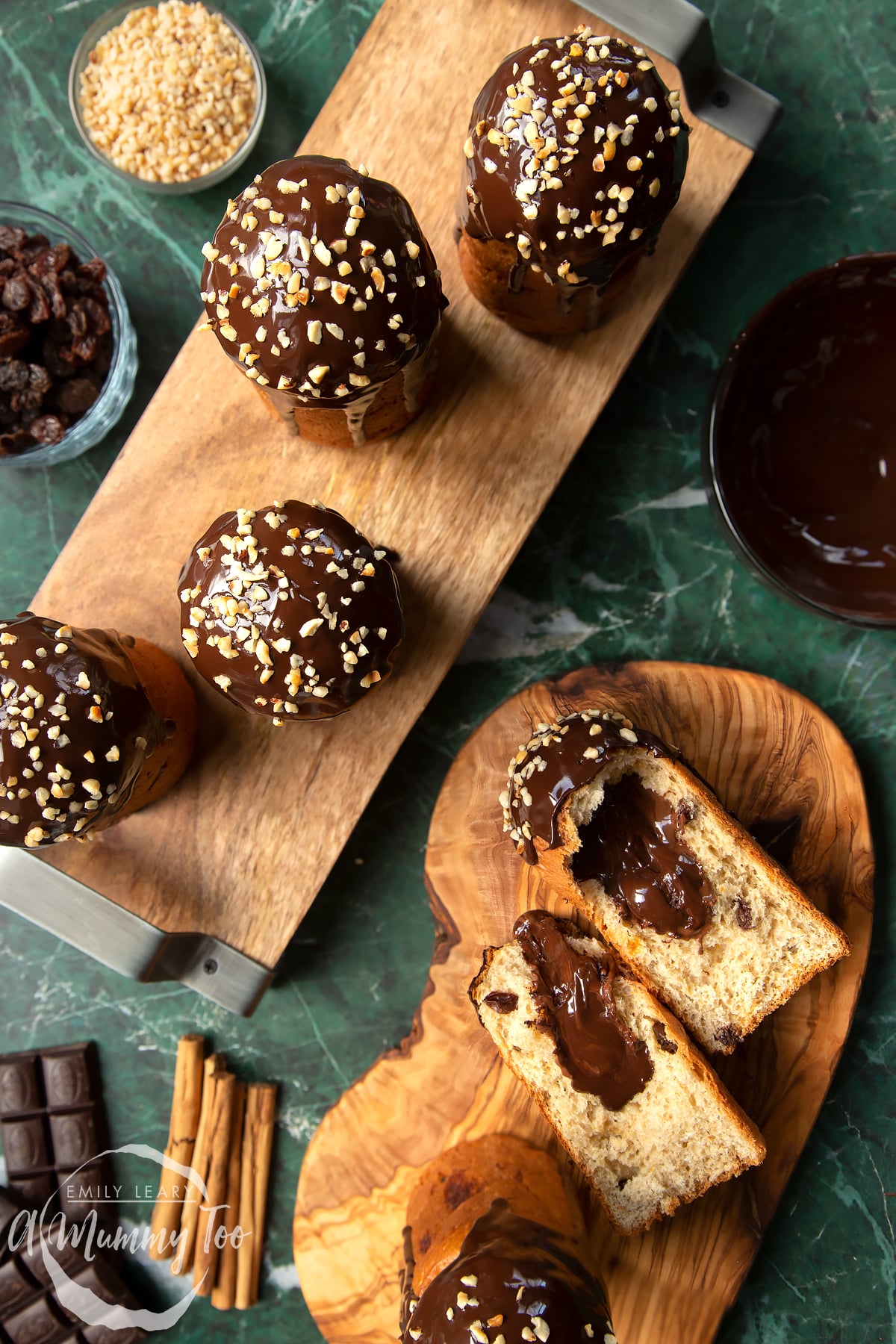 Nutella panettone standing on wooden boards. One of the panettone has been torn in half.