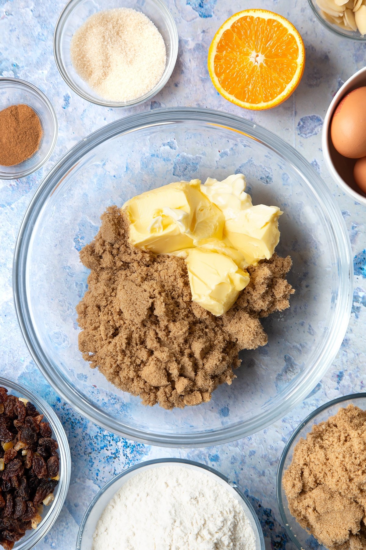 Overhead shot of butter and sugar in a large mixing bowl