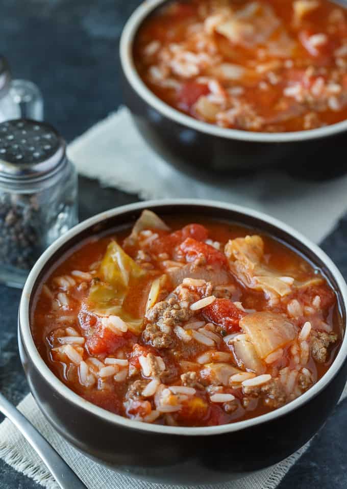 A black bowl filled with Cabbage Roll Soup.