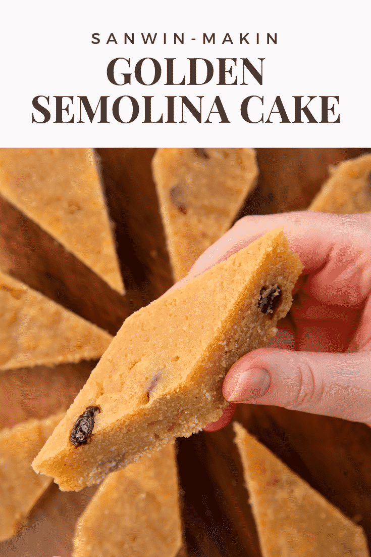 Hand holding a piece of sanwin-makin. More is shown on a wooden board. Caption reads: Sanwin-makin golden semolina cake