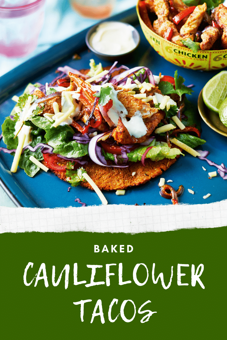 A cauliflower taco with salad and chicken on a blue tray. A bowl of chicken and vegetable filling is shown in the background. The caption reads: Baked cauliflower tacos