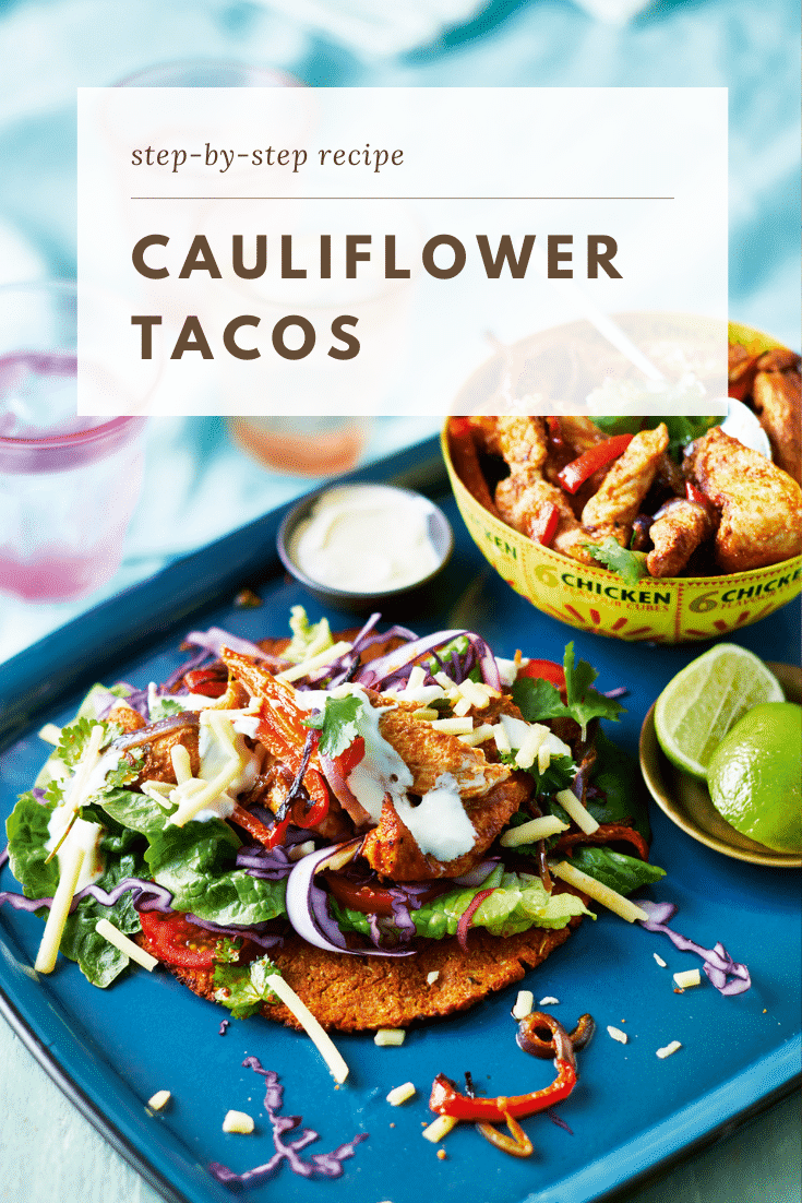 A cauliflower taco with salad and chicken on a blue tray. A bowl of chicken and vegetable filling is shown in the background. Limes are on a small plate. The caption reads: step-by-step recipe baked cauliflower tacos