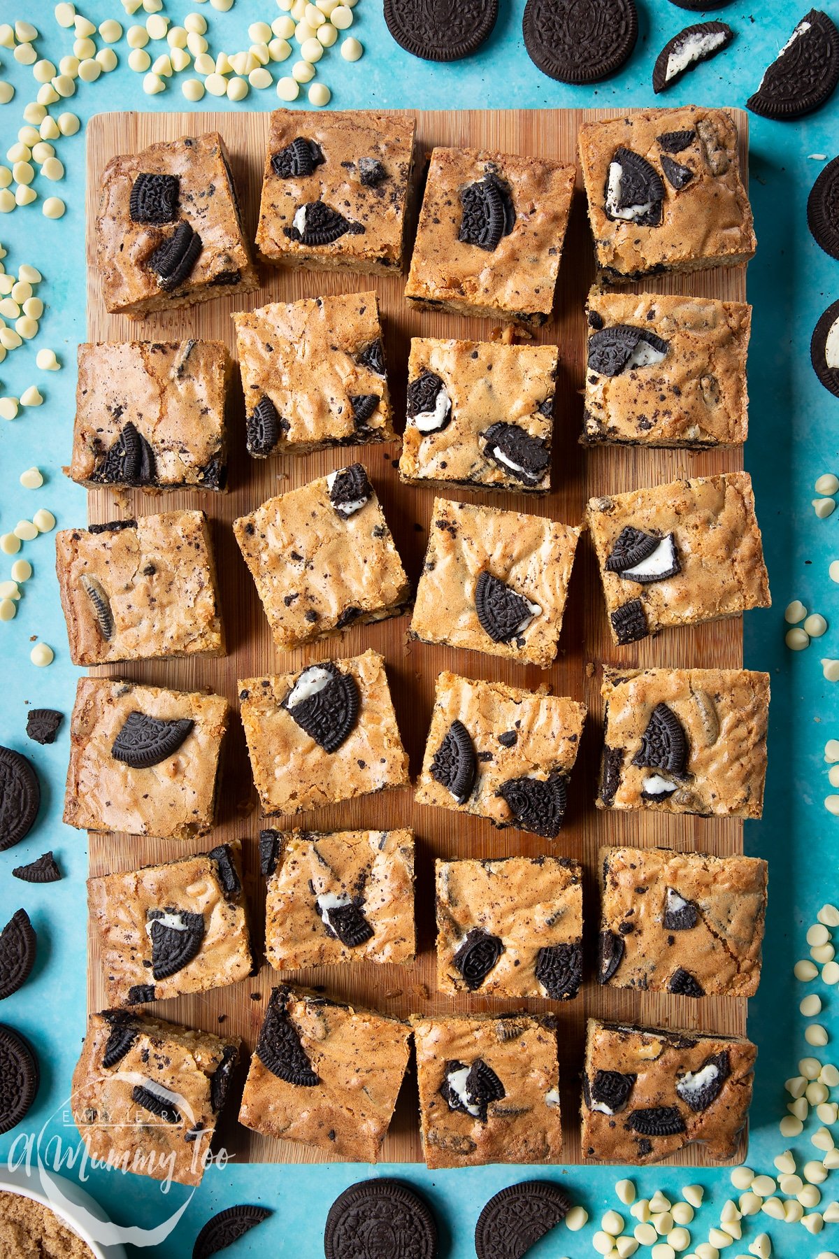 Overhead shot of square cut oreo blondies on a wooden board