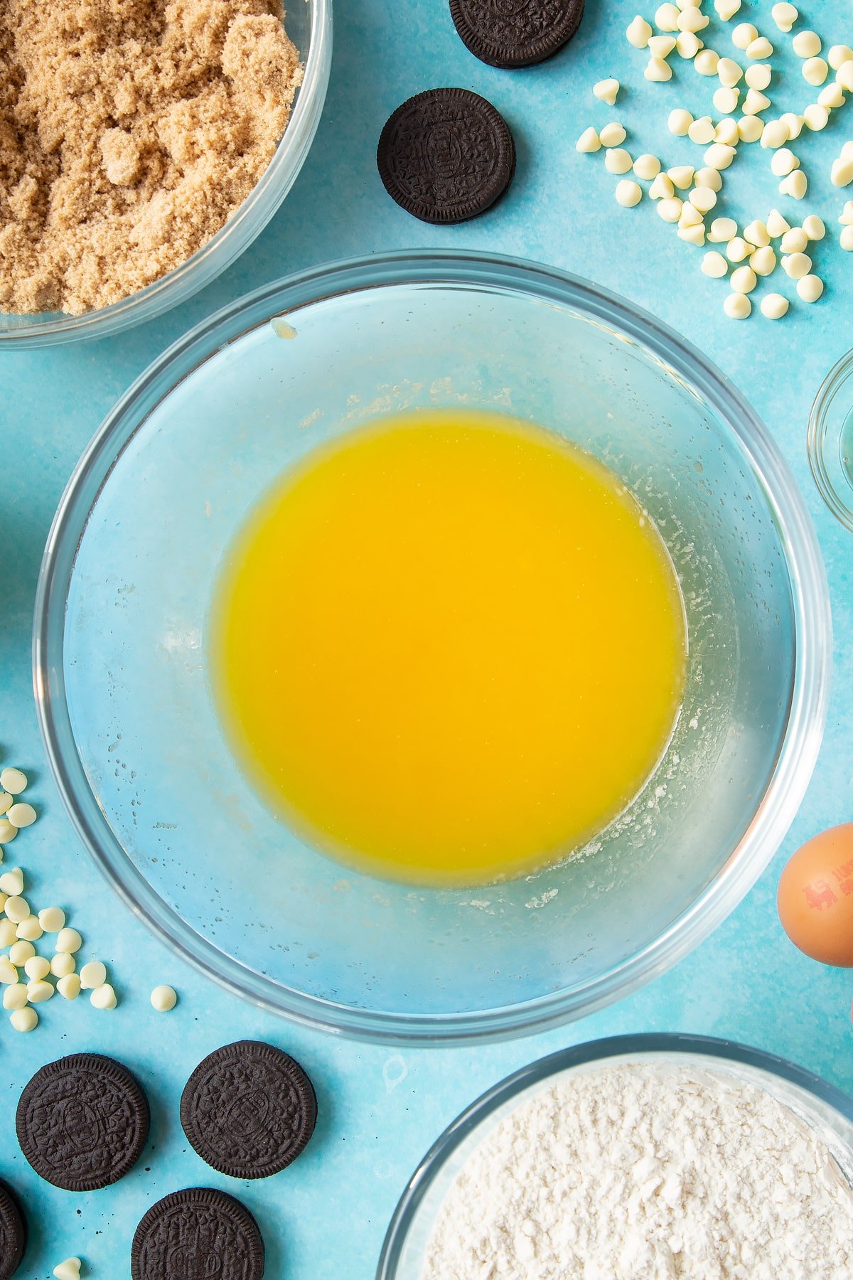 Overhead shot of melted butter in a large clear butter