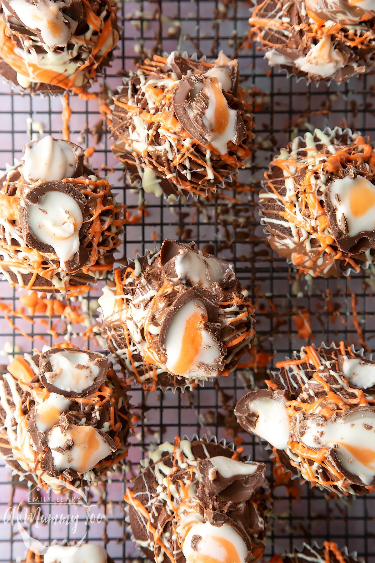 Cadbury Creme Egg cakes on a cooling rack, shown from above. 