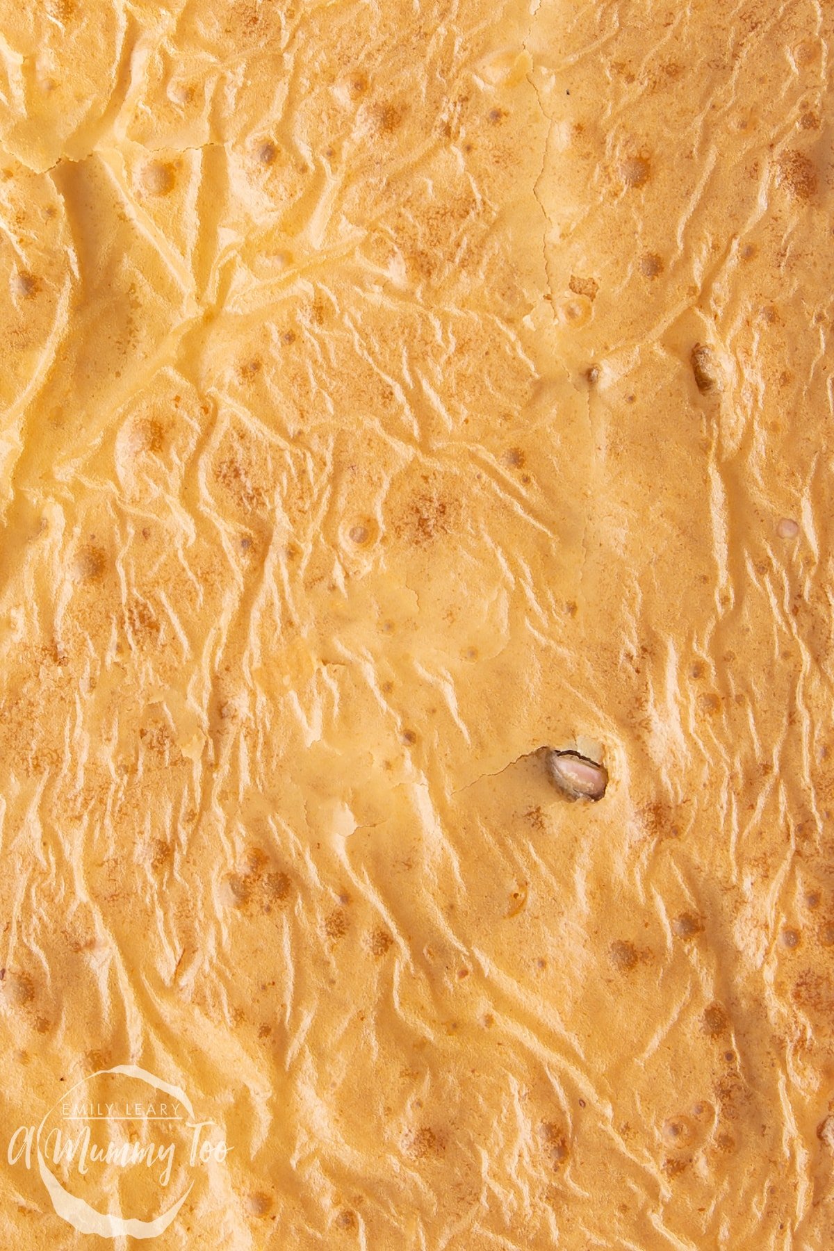 Close up of the shiny surface of freshly baked Mini Egg blondies.