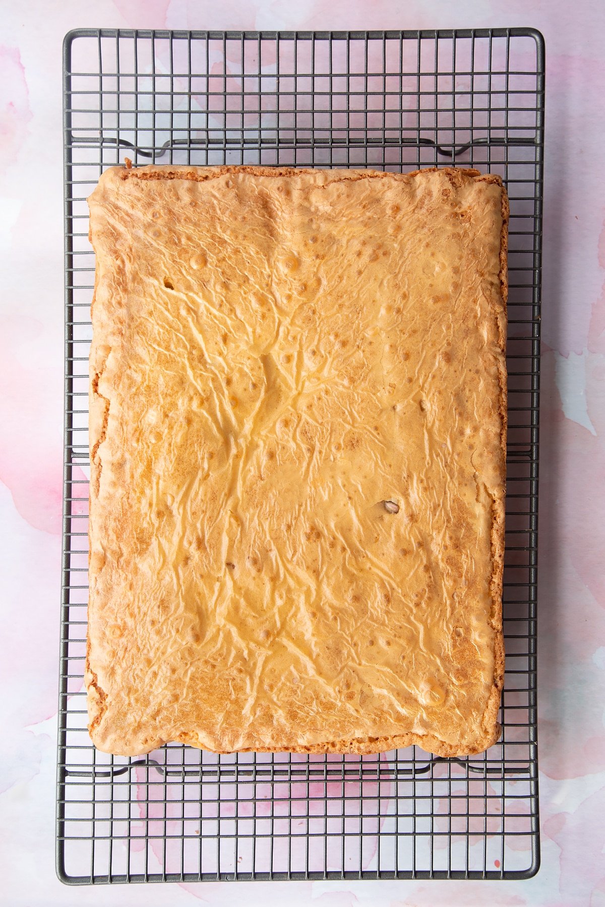 Mini Egg blondies cooling on a wire rack.