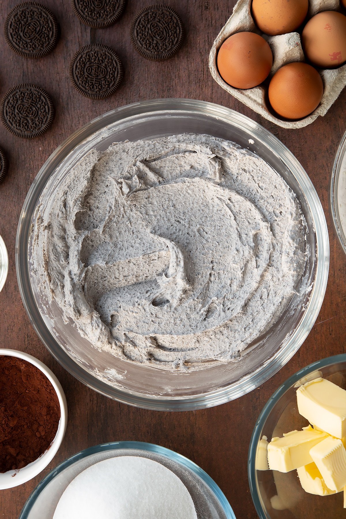 Overhead shot of whisked oreo buttercream in a large clear bowl