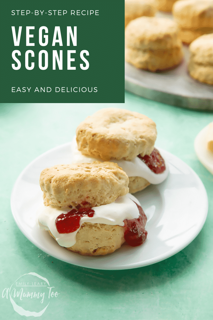 Two dairy free scones on a white plate. They are filled with jam and vegan whipped cream. Caption reads: Step-by-step recipe vegan scones easy and delicious.